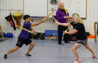 People practicing together in a martial arts class